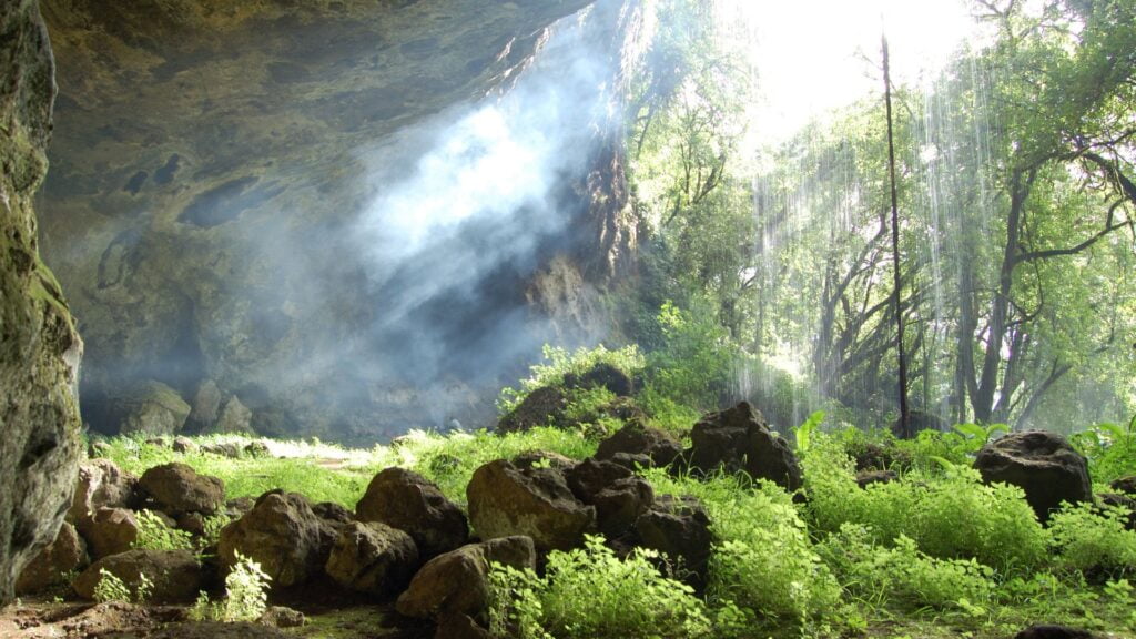 Tutum Cave with waterfall, Sipi trail, Mount Elgon, Uganda
